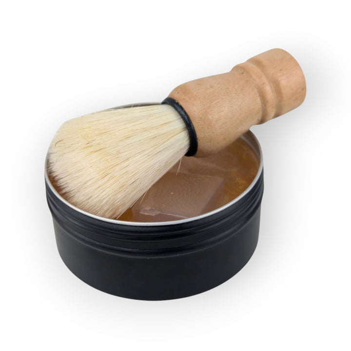 Glasgow Soap Company Ltd whisky scented shaving soap in black tin with vegan shaving brush and wooden handle.