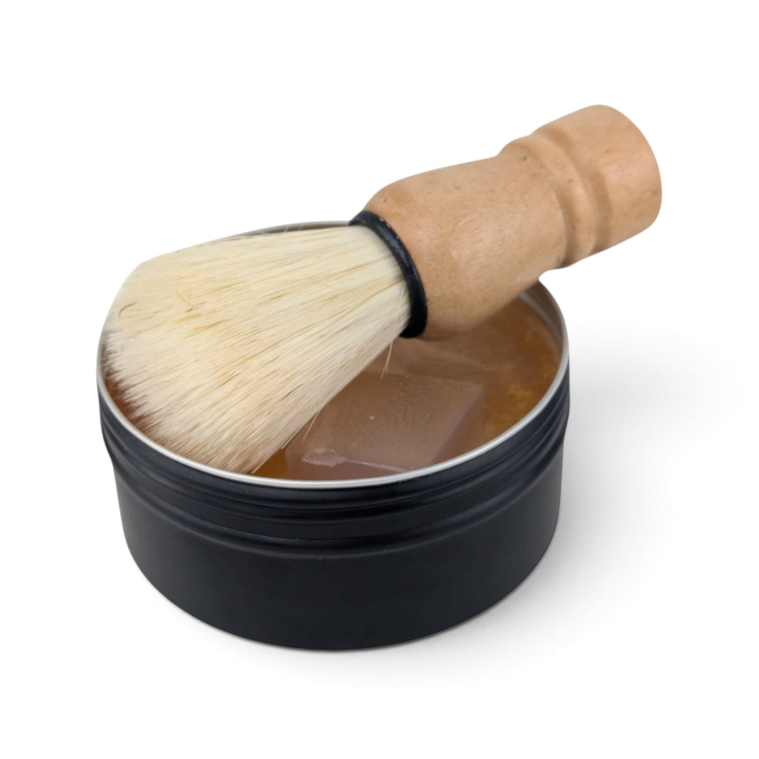 Glasgow Soap Company Ltd whisky shaving soap in a black tin with a wooden vegan shaving brush