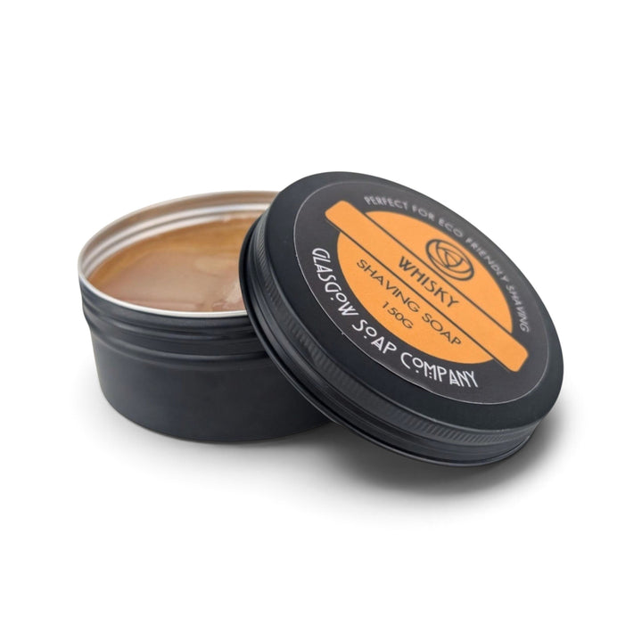 Glasgow Soap Company Ltd whisky scented shaving soap in a black metal tin with orange label, made in Scotland.