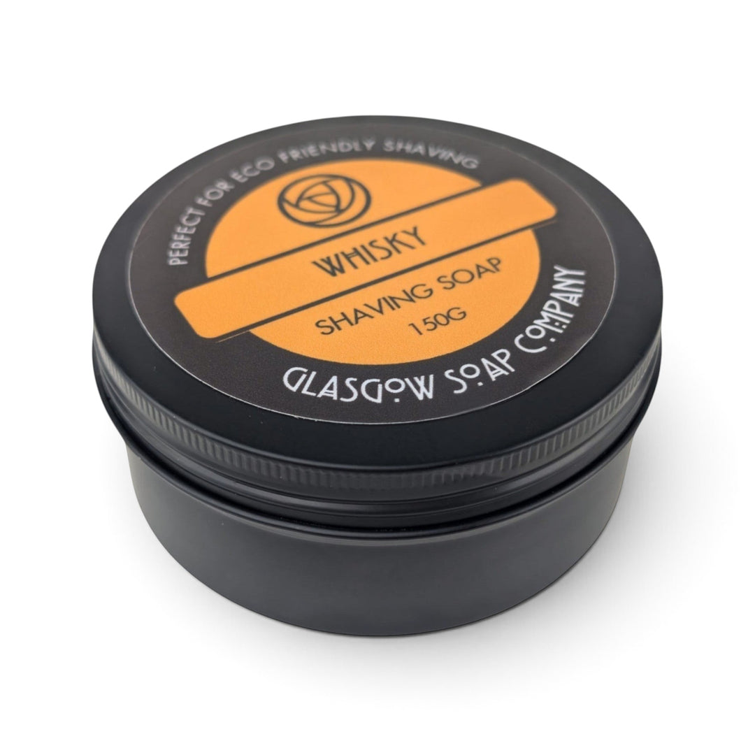 Glasgow Soap Company Ltd Whisky Shaving Soap in a black recyclable aluminium tin with orange label