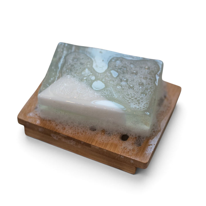 Glasgow Soap Company Ltd Winter Wonderland cranberry scented soap bar with blue and white layers on a wooden dish