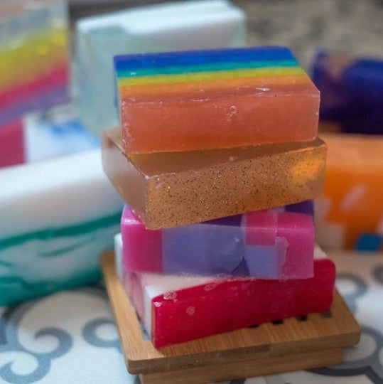 Glasgow Soap Company Ltd assorted handmade vegetable glycerine soap slices with colourful layers and glitter.