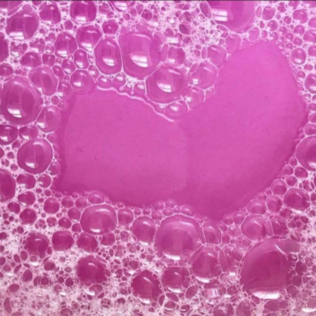 Glasgow Soap Company Ltd Parma Violet bath salts in pink bubbly water, 250g.
