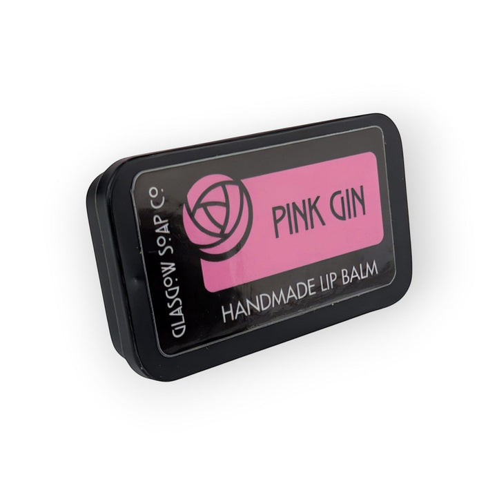 Glasgow Soap Company Ltd pink gin handmade lip balm in a black tin, raspberry flavour.