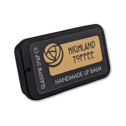 Handmade lip balm packaging with 'Highland Toffee' branding on a white background