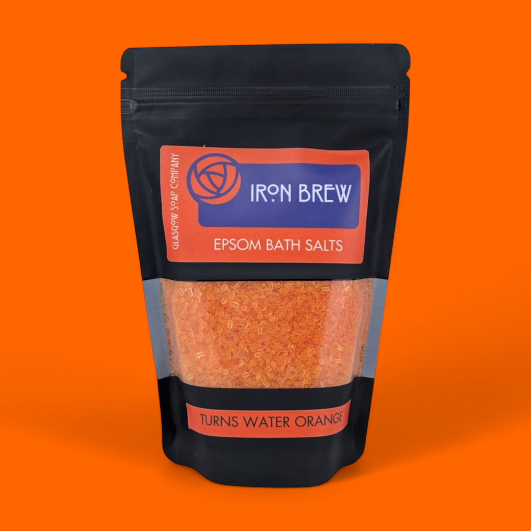 Package of Iron Brew Epsom Bath Salts on an orange background