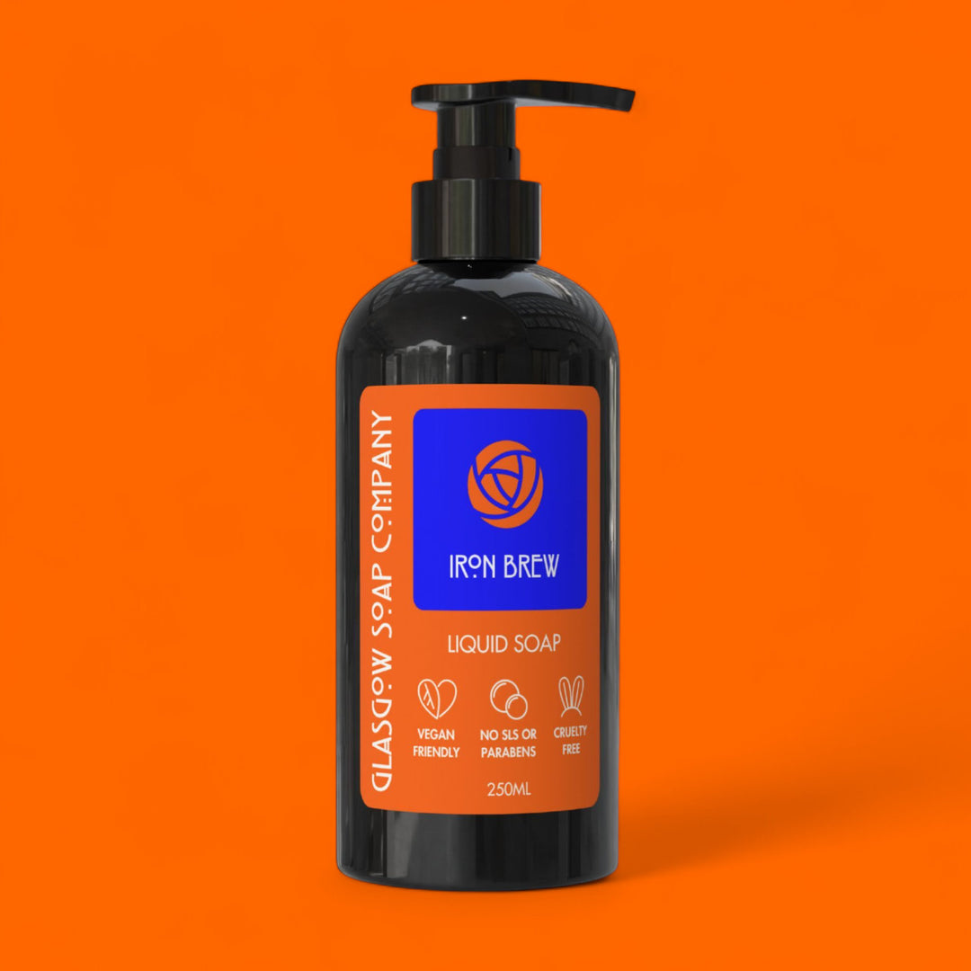 Black liquid soap bottle with pump on an orange background irn bru