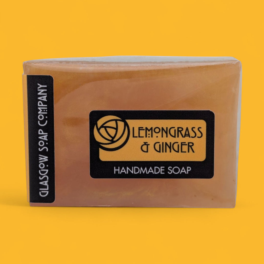 Handmade soap bar with 'Lemongrass & Ginger' scent from Glasgow Soap Company on a yellow background