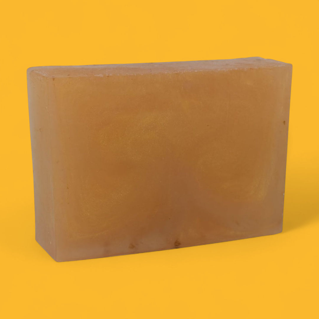 Rectangular brown bar of soap on a yellow background