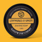 Shaving soap container with 'Lemongrass & Ginger' branding on a yellow background