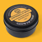 Shaving soap container with 'Lemongrass & Ginger' label on a yellow background