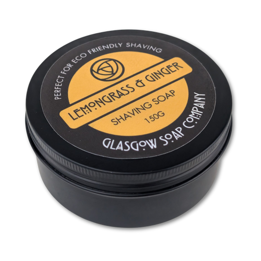 Shaving soap container with 'Lemongrass & Ginger' label on a white background