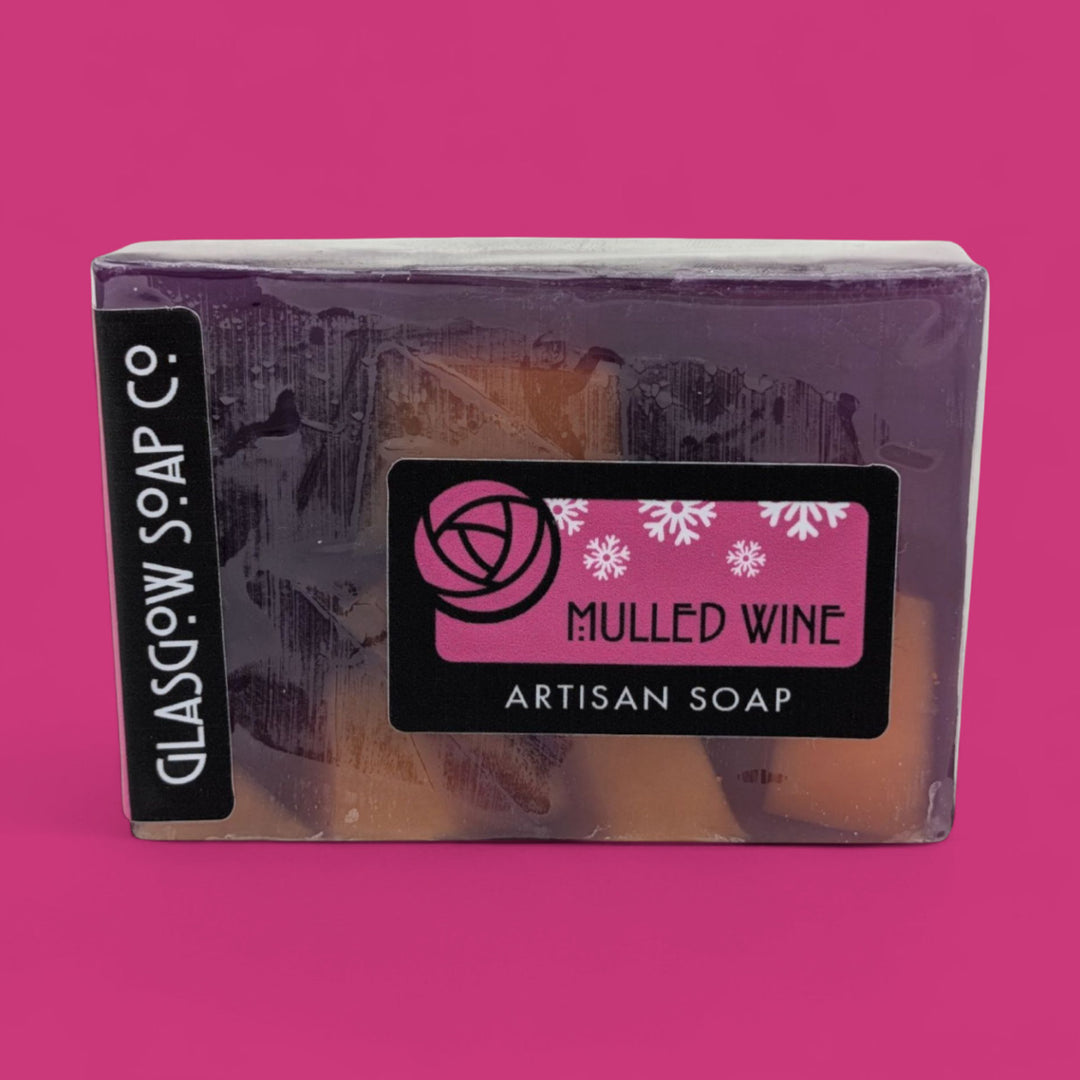 Packaged soap bar with 'Glasgow Soap Co.' branding on a pink background