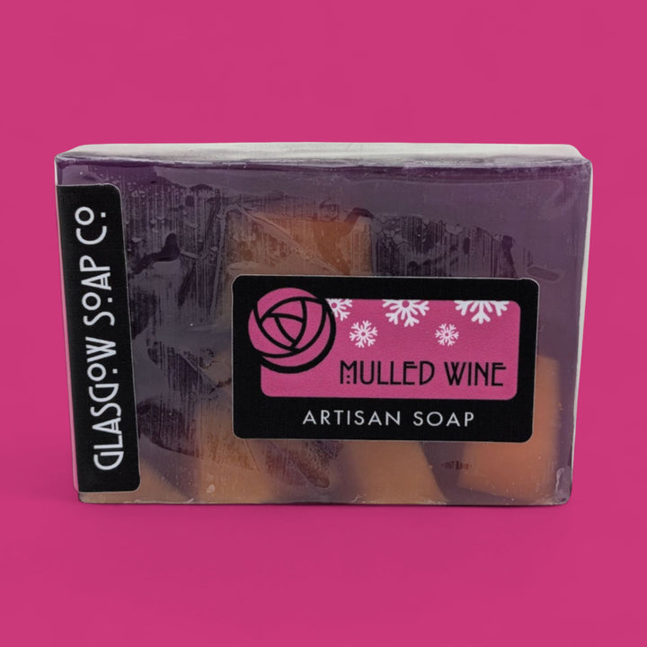 Packaged soap bar with 'Glasgow Soap Co.' branding on a pink background