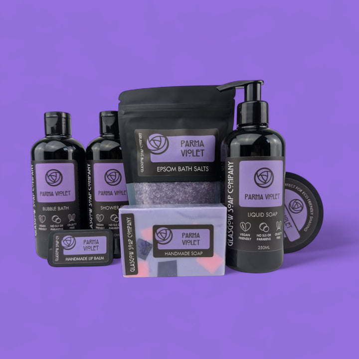 Collection of Parma Violet products on a purple background