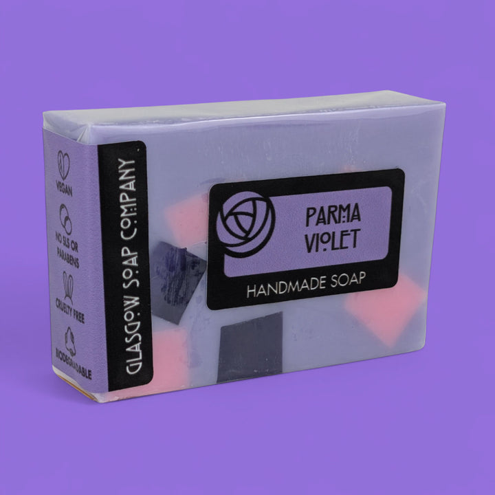 Bar of soap with 'Parma Violet' label on a purple background