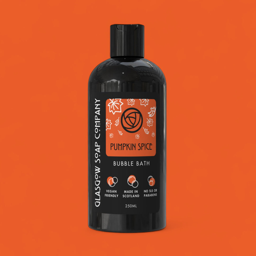 Black bottle of Glasgow Soap Company Pumpkin Spice Bubble Bath on an orange background