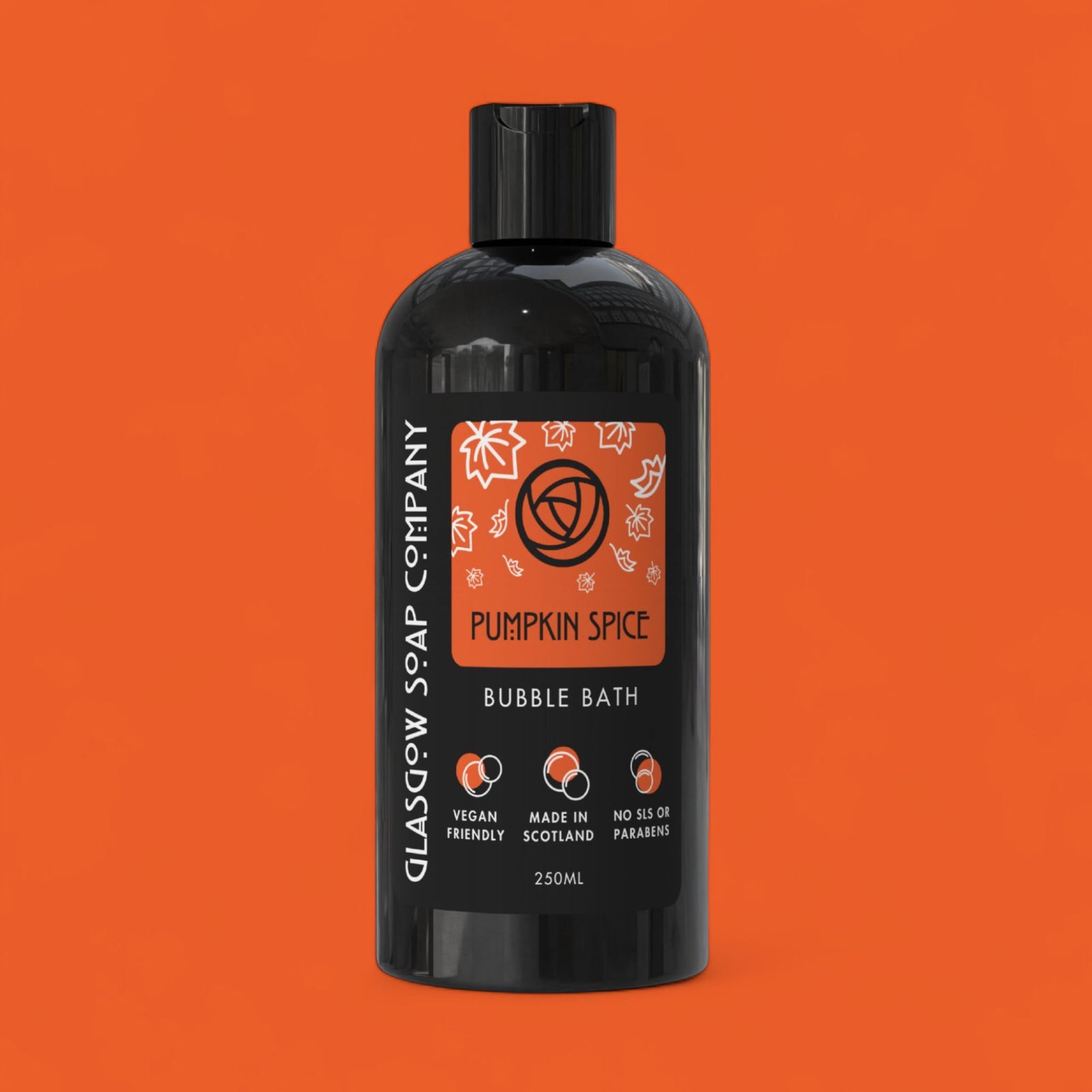 Black bottle of Glasgow Soap Company Pumpkin Spice Bubble Bath on an orange background
