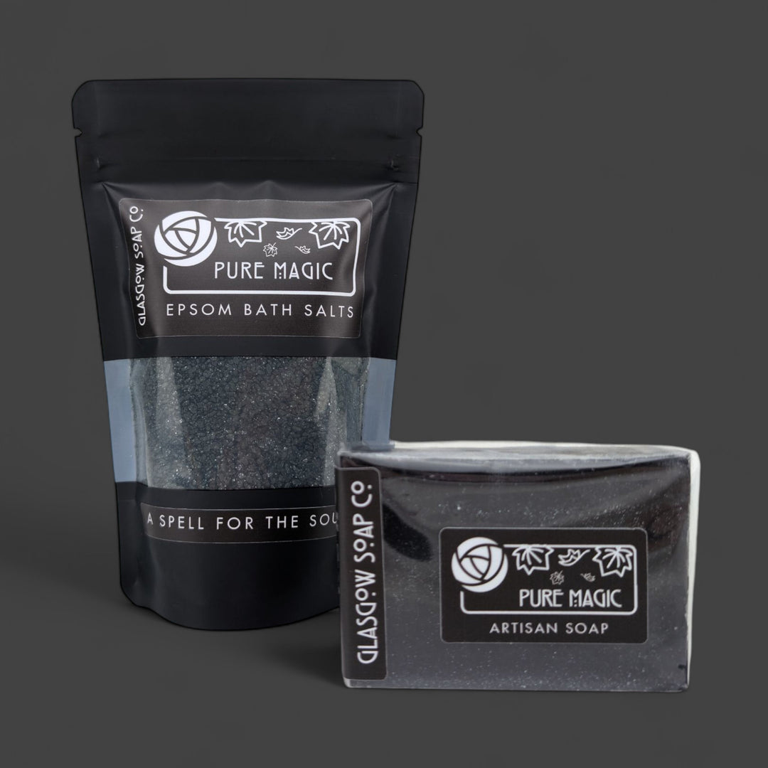 Packaged Epsom bath salts and artisan soap with 'Pure Magic' branding on a dark background