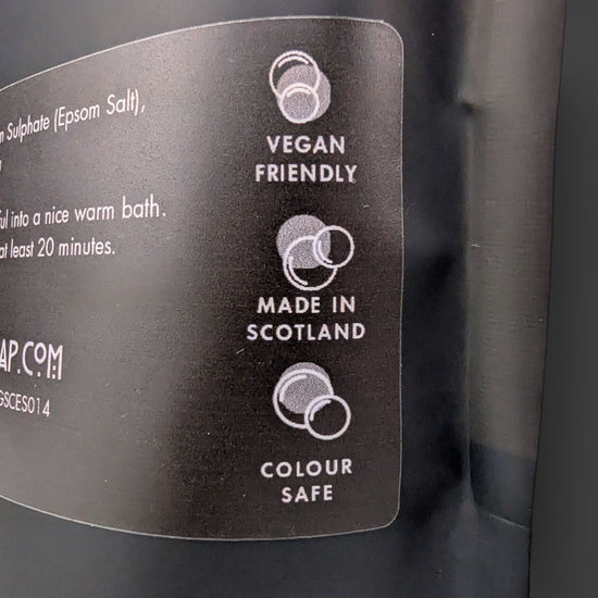Label on a product packaging indicating 'Vegan Friendly', 'Made in Scotland', and 'Colour Safe'.
