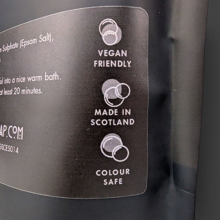 Label on a product packaging indicating 'Vegan Friendly', 'Made in Scotland', and 'Colour Safe'.