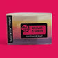Handmade soap bar with 'Rhubarb & Ginger' label on a pink background