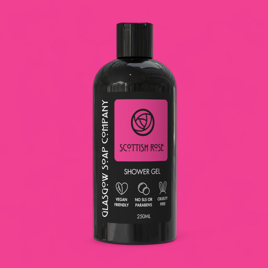 Black bottle of Glasgow Soap Company Scottish Rose Shower Gel on a pink background