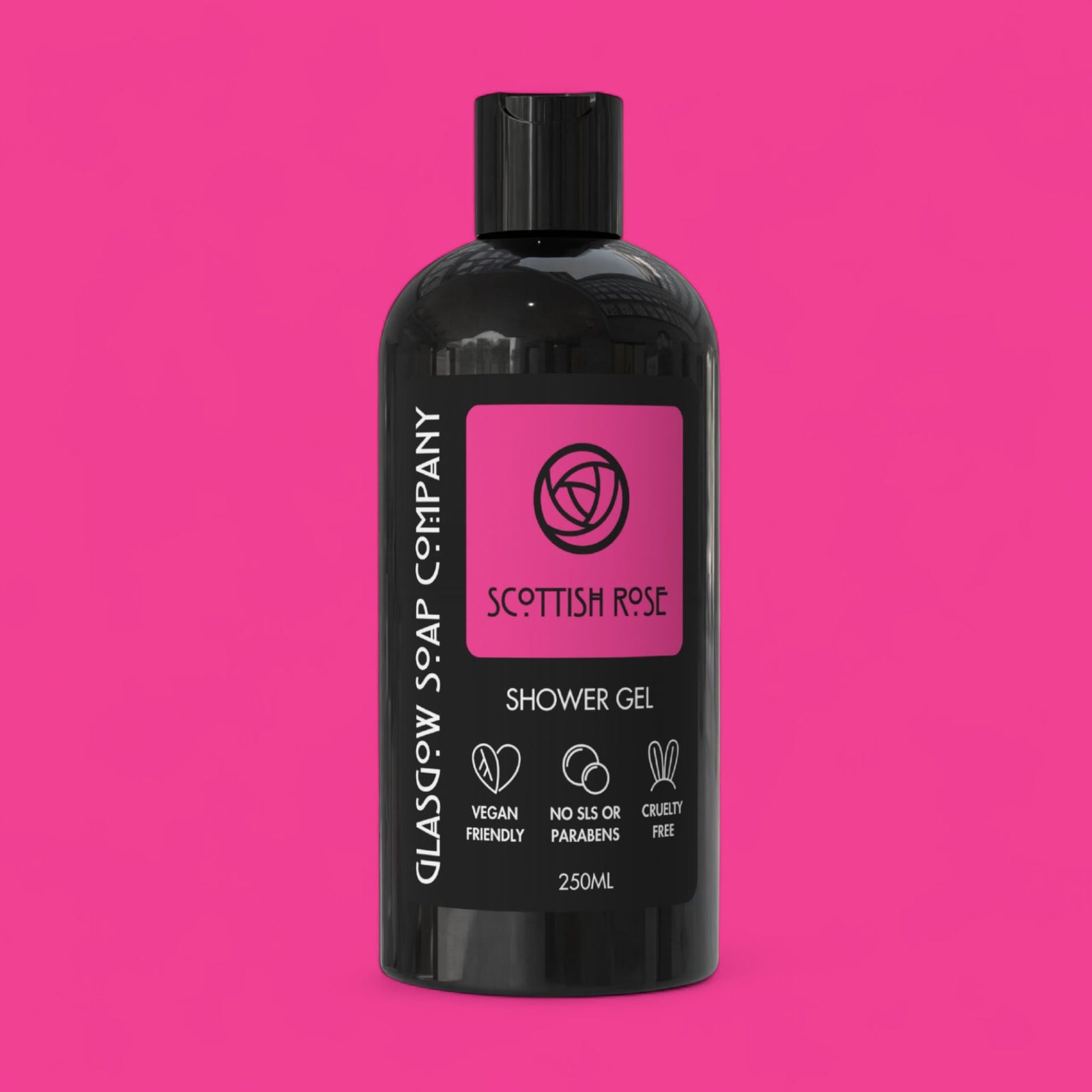 Black bottle of Glasgow Soap Company Scottish Rose Shower Gel on a pink background