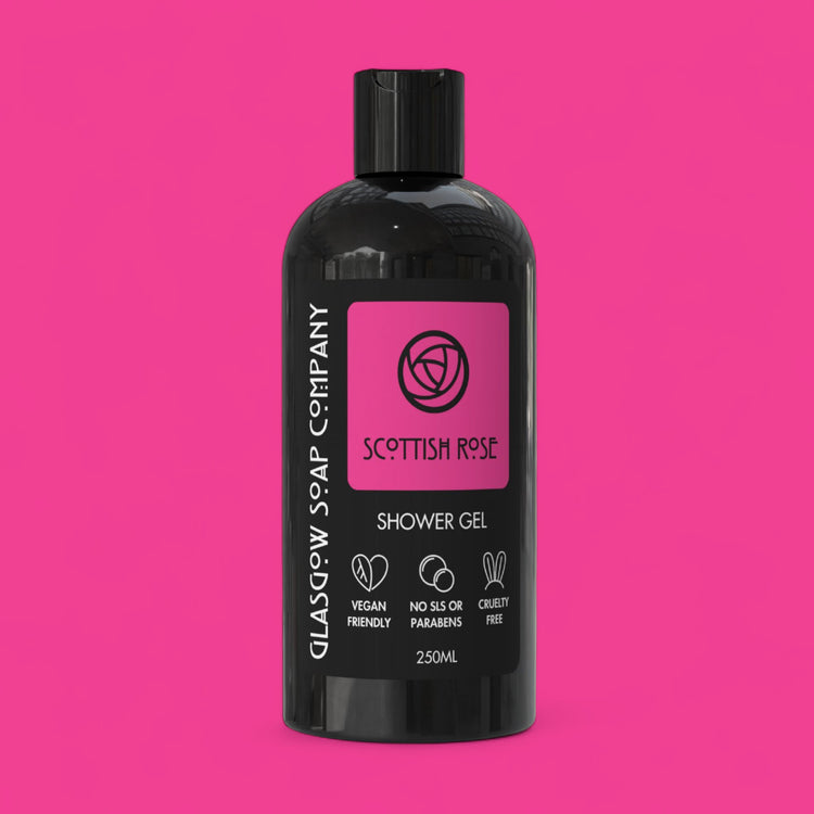 Black bottle of Glasgow Soap Company Scottish Rose Shower Gel on a pink background