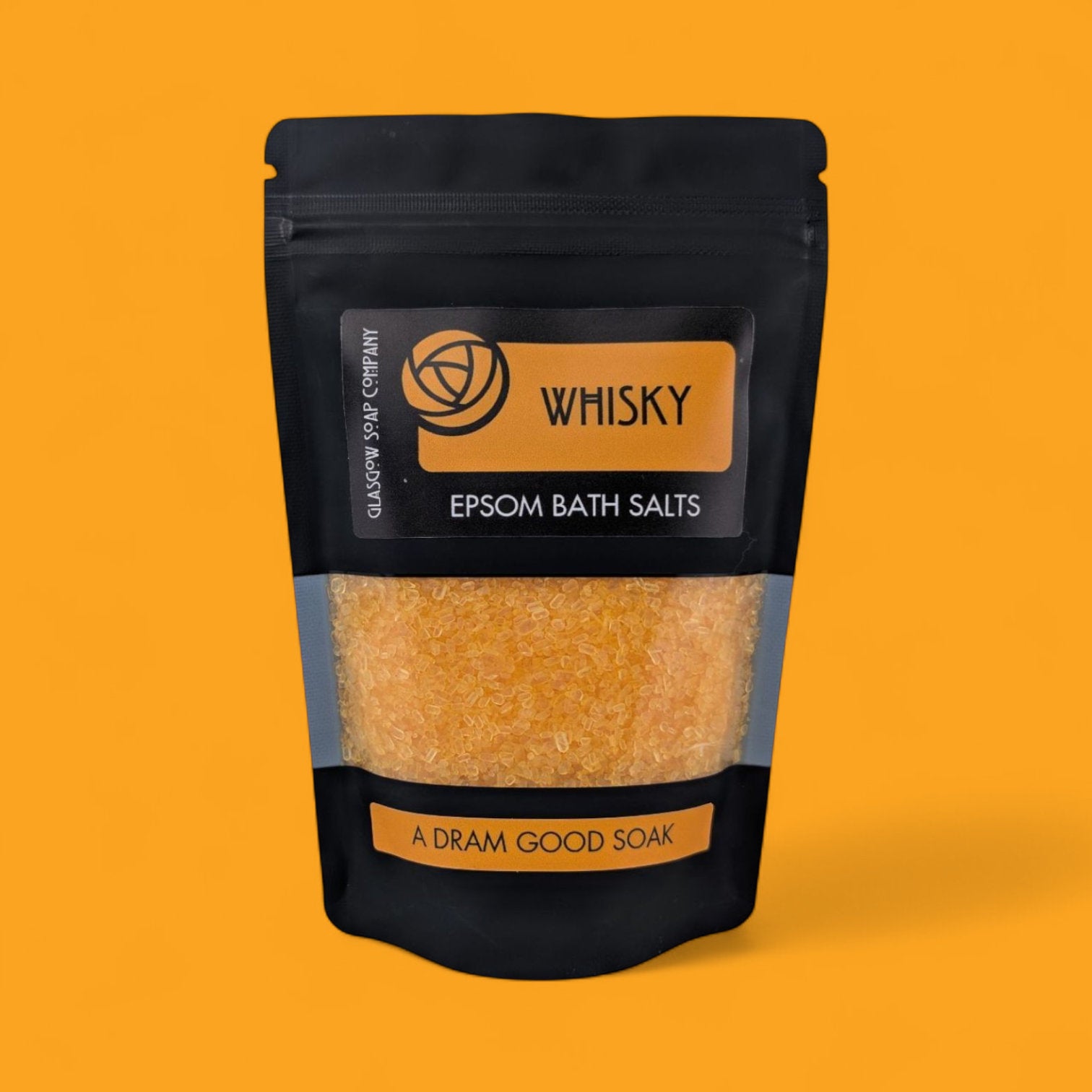Pack of Epsom bath salts with whisky fragrance on a yellow background