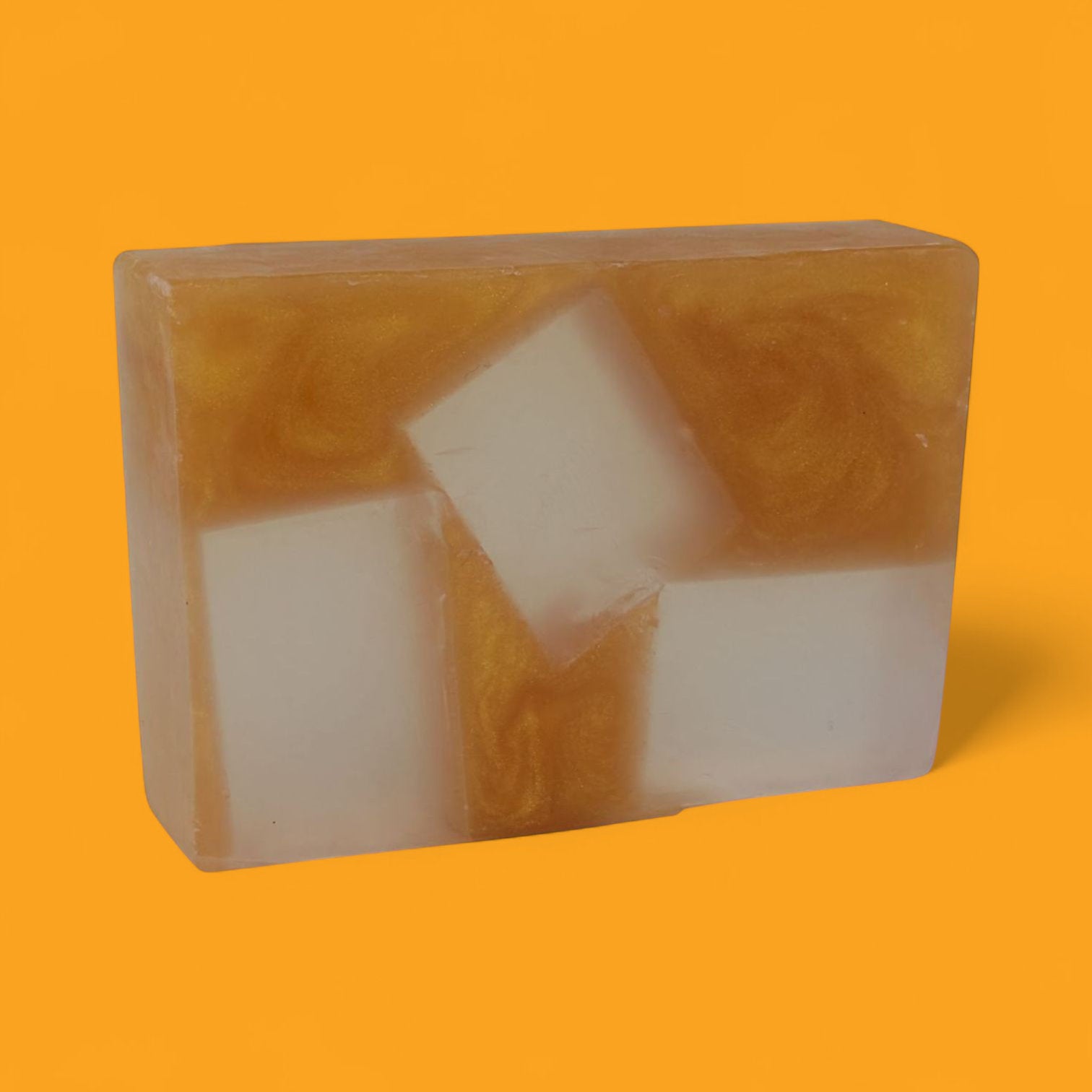 gold bar of handmade whisky soap with  clear squares symbolising ice cubes