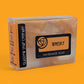 Handmade soap bar Whisky packaging on an orange background