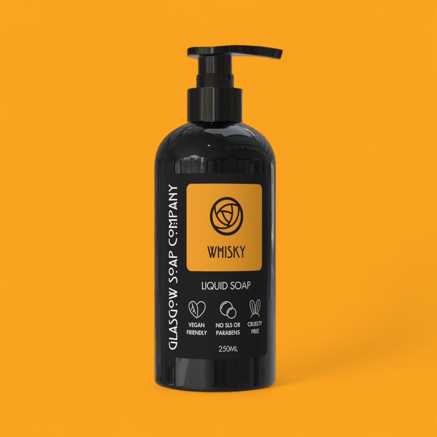 Black bottle with pump of Glasgow Soap Company Whisky liquid soap on an orange background