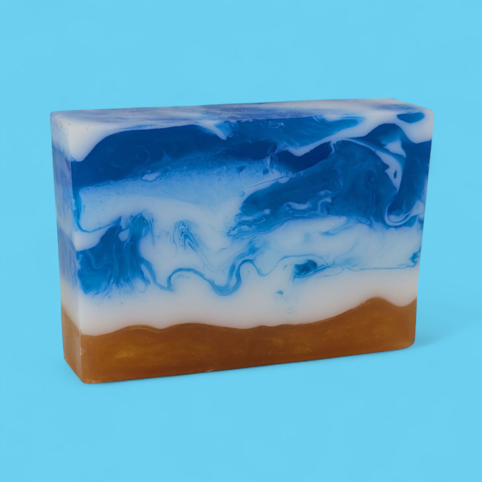 Bar of soap with blue and white swirls on a blue background