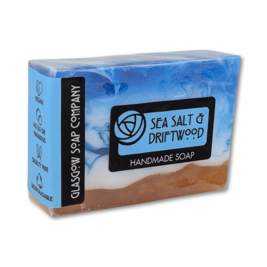 Handmade soap bar with 'Sea Salt & Driftwood' label on a white background