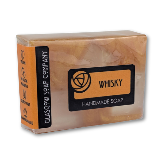 Handmade soap bar from Glasgow Soap Company with 'Whisky' fragrance on an orange packaging.
