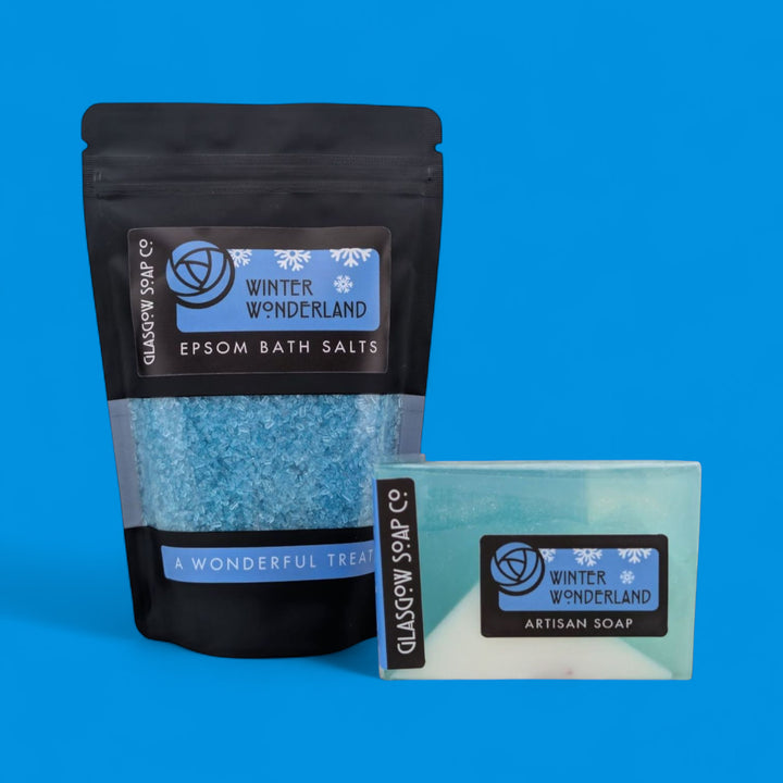 Pack of Epsom bath salts and a bar of soap with 'Winter Wonderland' branding on a blue background.