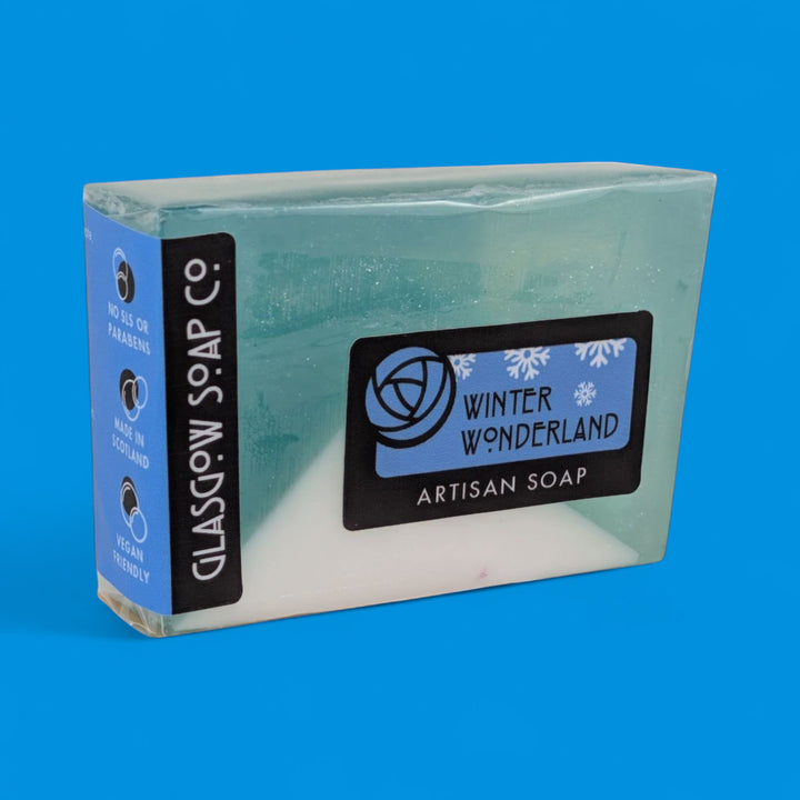 Artisan soap bar with 'Winter Wonderland' label on a blue background