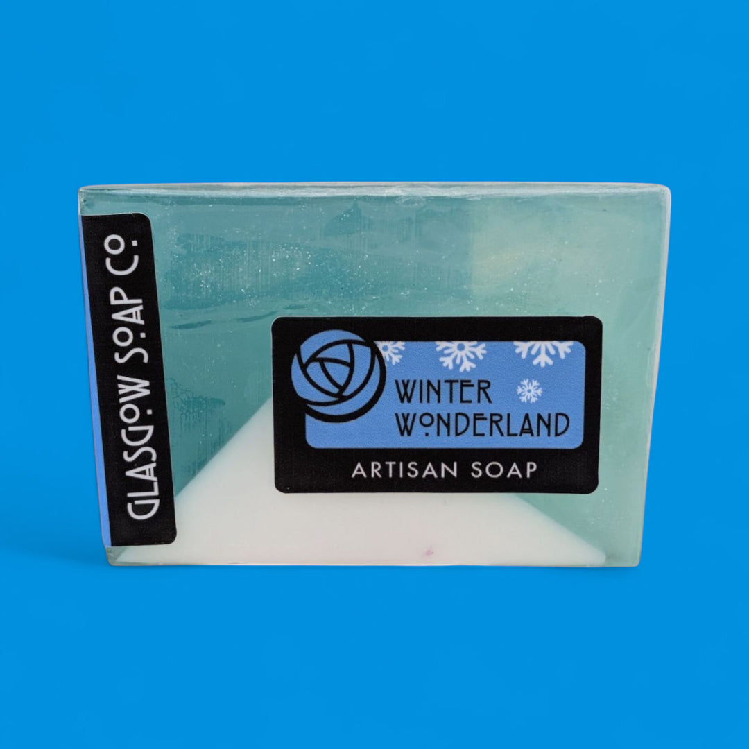 Artisan soap bar with 'Winter Wonderland' label on a blue background